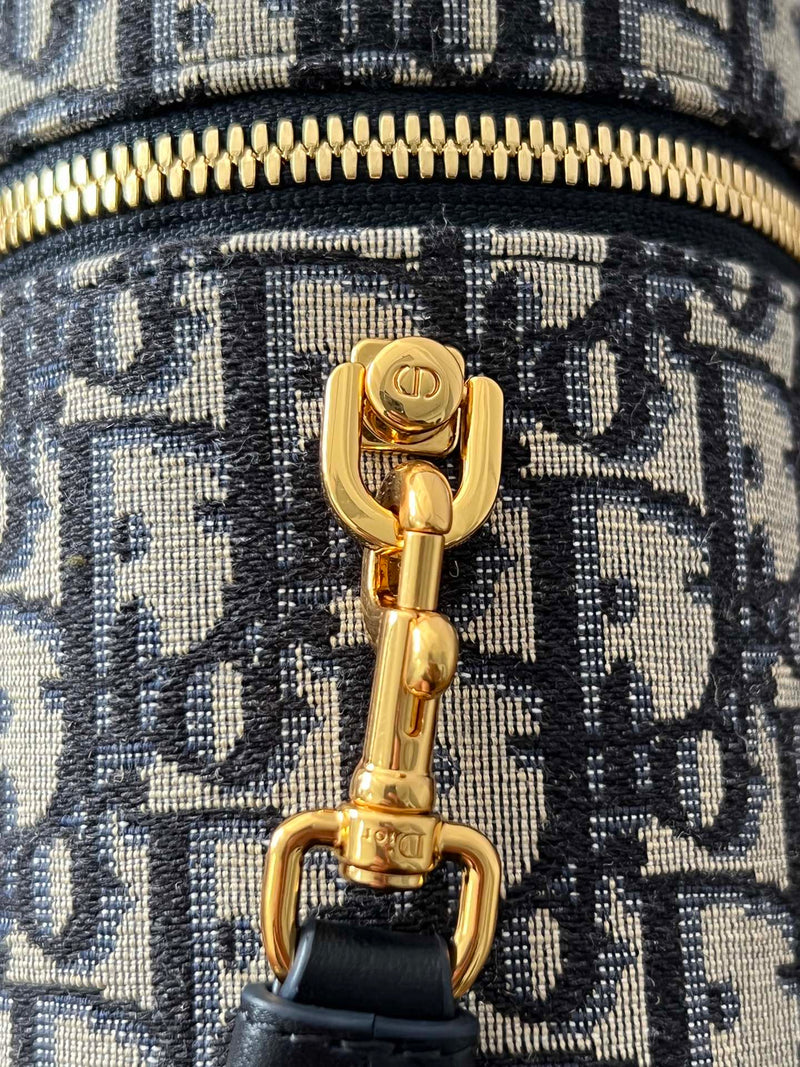 Close-up of gold-tone Dior clasp and zip pull on restored used CD Signature Vanity Bag, showcasing Empyrean’s polishing and hardware detailing.
