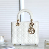 Front view of restored used Medium Lady Dior bag in white patent leather with gold hardware and signature Dior letter charm, by Empyrean Atelier.