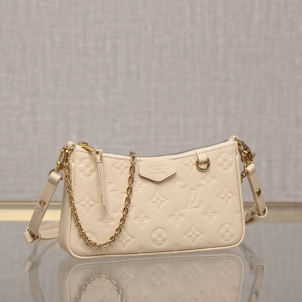 Pre-owned and expertly restored Louis Vuitton Easy Pouch On Strap in cream embossed leather with gold-tone chain and adjustable strap. Restored by Empyrean Atelier.