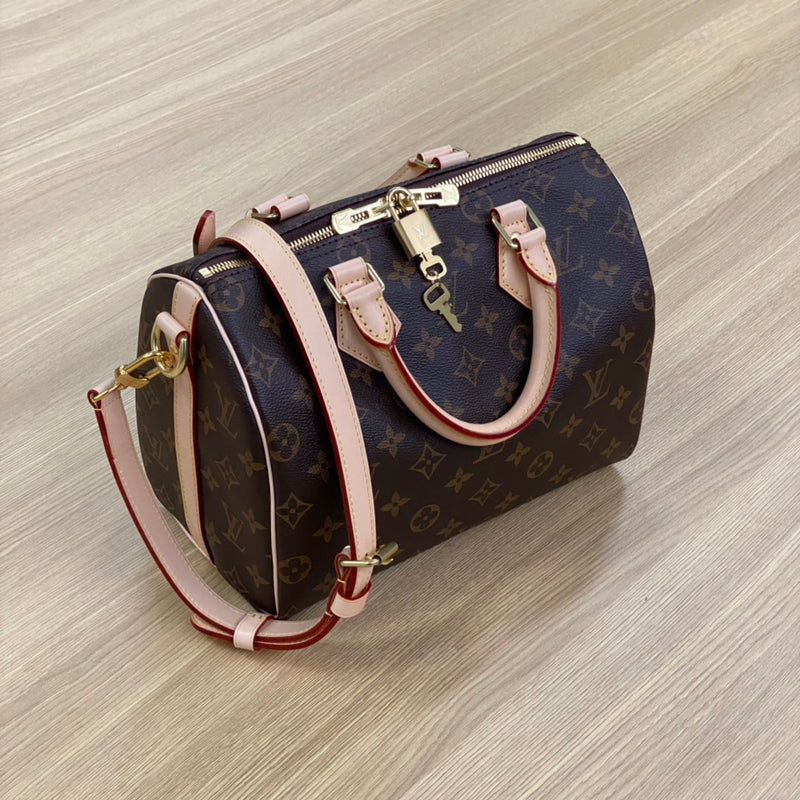 Pre-owned restored Louis Vuitton Speedy 25 bag in Monogram canvas with vachetta leather and gold-tone lock, restored by Empyrean Atelier
